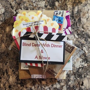 Blind Date with Dinner and a Movie -includes a movie and a gift card to a chain restaurant, etc...