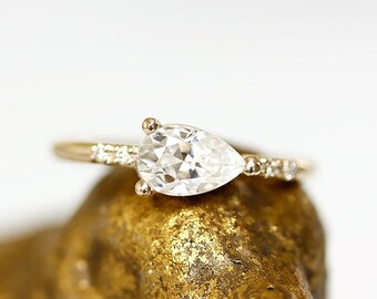 lilia pear moissanite ring, sideways pear, made with SCS recycled 14k and 18k gold