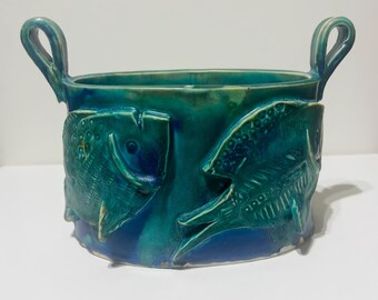 Contenitore in ceramica con disegno a forma di pesce