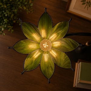 Underside view of handmade botanical stained glass flower lampshade showing handcrafted glass petals and brass fitting