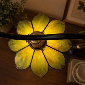 Top view of handmade green stained glass flower floor lamp with botanical petal design and warm E26 lighting