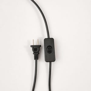 Black plug and inline switch detail for the piano stained glass table lamp cord