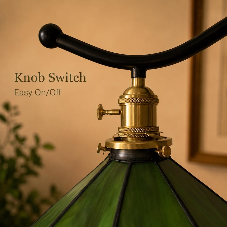 Antique brass knob switch on vintage stained glass floor lamp with curved metal arm and E26 socket