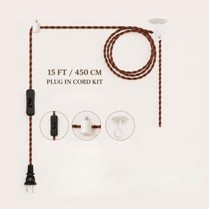 15 ft plug-in lamp cord with US plug, inline on-off switch, cable hook and ceiling hook, shown without a lamp holder.