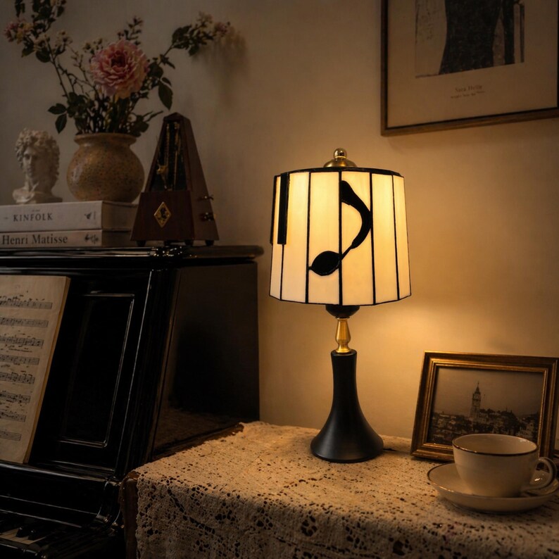 Music note stained glass table lamp styled in a warm piano room corner for music lovers and pianists.