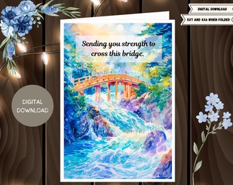 Peut inclure: Une peinture à l'aquarelle d'un pont au-dessus d'une rivière en furie. Le pont est en bois et a un design japonais traditionnel. L'eau est d'un bleu et d'un vert vifs, et les arbres environnants sont luxuriants et verts. Le texte "Sending you strength to cross this bridge." est écrit en blanc sur un fond blanc.
