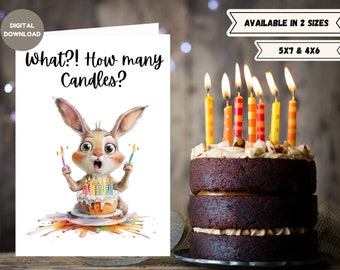 Peut inclure: Une carte d'anniversaire numérique à télécharger représentant un lapin de dessin animé tenant une bougie allumée et un gâteau avec de nombreuses bougies. La carte dit "What?! How many Candles?" et est disponible en deux tailles : 5x7 et 4x6 pouces.