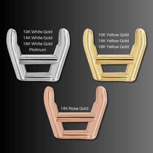May include: Three metal rings in different colors: silver, gold, and rose gold. The rings are shaped like a letter H with a horizontal bar in the middle. The text on the rings reads: 10K White Gold, 14K White Gold, 18K White Gold, Platinum, 10K Yellow Gold, 14K Yellow Gold, 18K Yellow Gold, 14K Rose Gold.