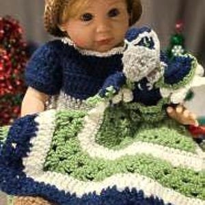 May include: A crocheted baby doll outfit in blue, green, and brown with a matching hat and a crocheted stuffed animal.