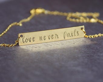 Love Never Fails Necklace - Bar Necklace - Hand Stamped Jewelry - Gold Stainless Steel