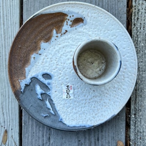 May include: A rustic wooden sign with the text "Welcome to our home" in white lettering. The sign features a distressed finish and a simple, inviting design, perfect for entryway decor.