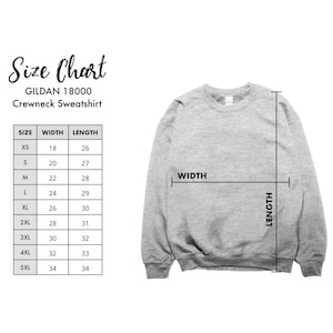 May include: A light grey Gildan 18000 crewneck sweatshirt displayed with a size chart. The chart lists sizes XS through 5XL with corresponding width and length measurements in inches. Arrows on the sweatshirt indicate how to measure width and length.
