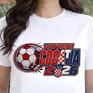 May include: White t-shirt featuring a soccer ball design with red and white accents, and the text "VATRENI CROATIA 2026". The design includes the Croatian flag colors and a shield emblem.
