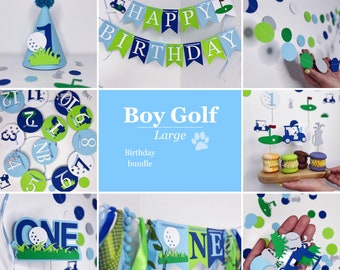 Op de afbeelding: Een Boy Golf-thema feestdecoratiepakket. De set bevat een Happy Birthday-banner, een eenjarige taarttopper, een golfkar-cupcaketopper en een set ronde confetti met golfbal- en golfkarontwerpen.