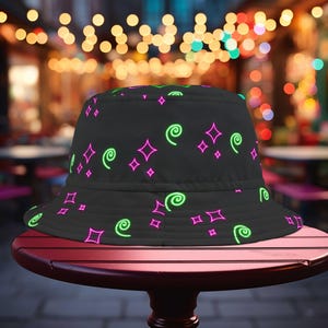 Let&#39;s Glow Crazy Bucket Hat for 90s Parties - Black Bucket Cap with Neon Print, Blacklight Events, Glow in the Dark
