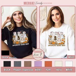 May include: Black and white sweatshirts with a Halloween-themed graphic. The design features ghost characters dressed as nurses, pumpkins, and the text "INTENSIVE SCARE UNIT." Available in seven colors, including black and white.