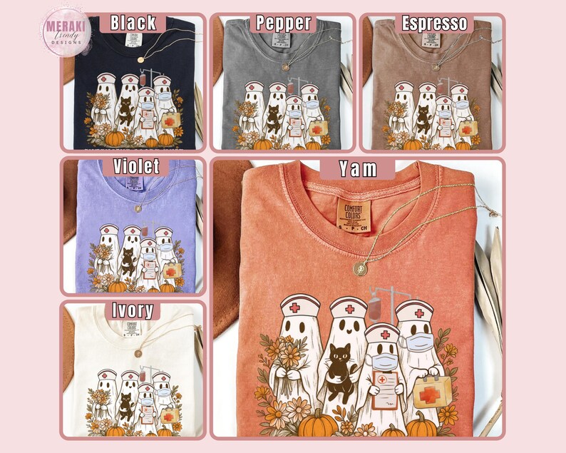 May include: A collection of Comfort Colors t-shirts in various colors, including black, pepper, espresso, violet, ivory, and yam. Each shirt features a graphic of ghost nurses with pumpkins and flowers. A gold necklace is included with each shirt.