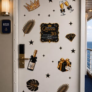 May include: A white door decorated with black and gold stickers including a crown, champagne flutes, a diamond, palm leaves, a gift box, and a central sign reading Birthday Queen Sailing Into 30 Ashley's Birthday Getaway Cruise 2026.