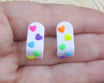 Clay huggies hoops with neon rainbow hearts