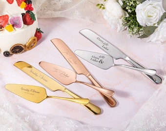 May include: Four personalized cake servers in gold, rose gold, and silver. The servers are engraved with names and dates. The servers are on a white background.