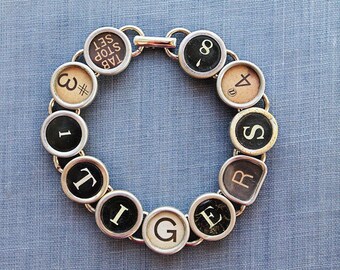 Roaring Style: Unique Typewriter Key Bracelet with a Tiger's Touch!