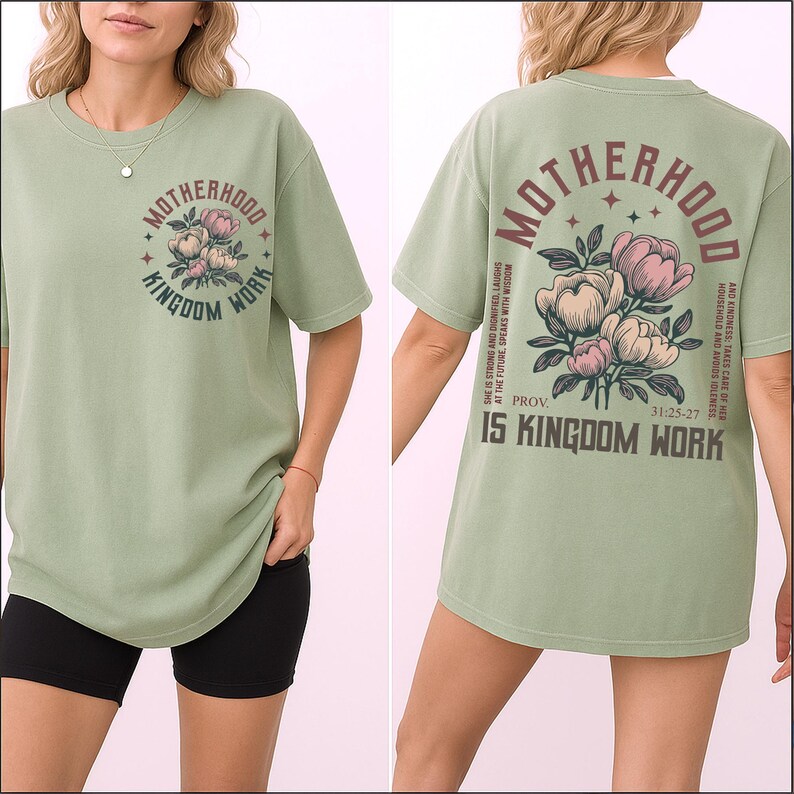 May include: Sage green t-shirt with the words "MOTHERHOOD KINGDOM WORK" in a circular design on the front. The back of the shirt features the same text with a floral design and the Bible verse Proverbs 31:25-27.