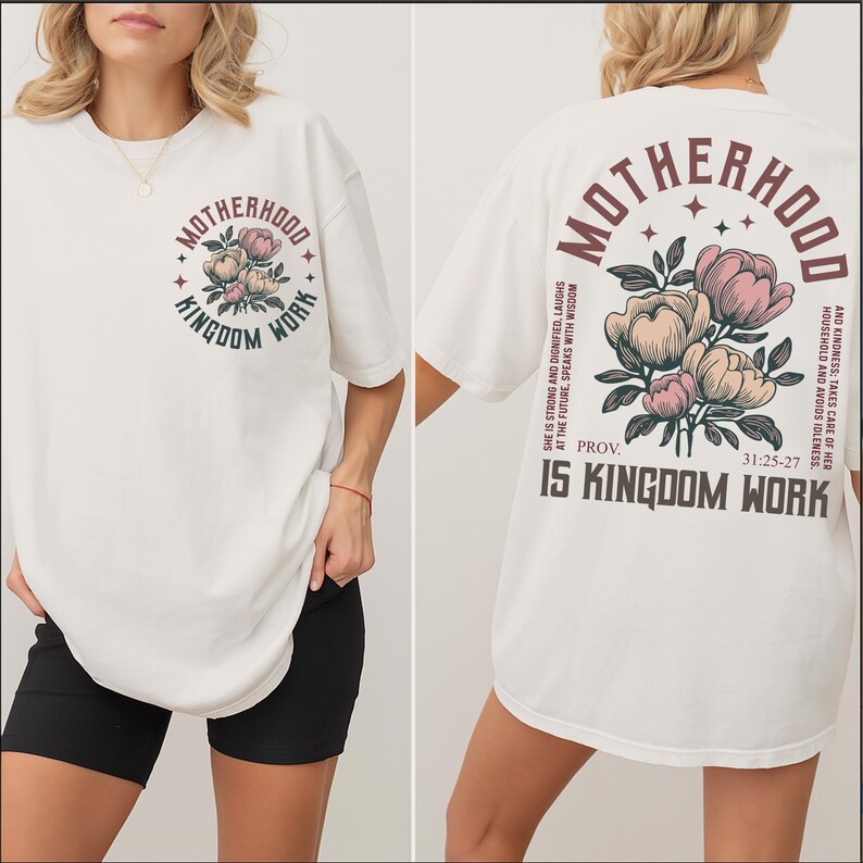 May include: Off-white t-shirt with a floral design and the words "Motherhood Kingdom Work" in a circular design on the front. The back of the shirt features the words "Motherhood" and "Kingdom Work" with a floral design and a Bible verse.