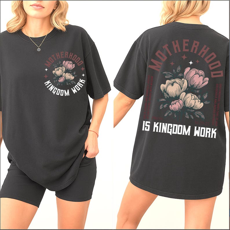 May include: Dark gray t-shirt with the words "Motherhood is Kingdom Work" printed on the back. The front of the shirt features a floral design with the words "Motherhood" and "Kingdom Work" in a circular arrangement.