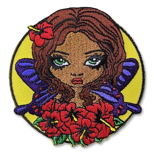 May include: Embroidered patch featuring a stylized woman with brown skin, green eyes, and red lips. She has brown hair and is adorned with a red hibiscus flower. Purple butterfly wings and red hibiscus flowers complete the design, set against a yellow background.