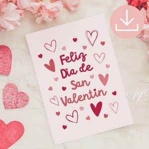 May include: A Valentine's Day card with the text "Feliz Día de San Valentín" in shades of red. The card is decorated with various heart shapes. Pink flowers and heart-shaped cutouts surround the card.