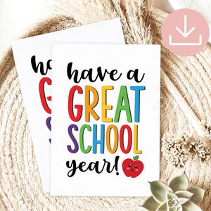 May include: Two white rectangular cards featuring the black text have a and year! with the colorful word GREAT in red, orange, yellow, green, and blue, and the word SCHOOL in green, blue, orange, and red, plus a small red smiling apple graphic.