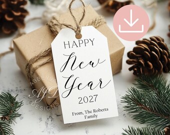 May include: A white rectangular gift tag with a hole at the top and a jute twine loop. The tag features black printed text that reads HAPPY New Year 2027 and From, The Roberts Family. The design uses a mix of sans-serif and script fonts.
