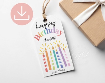 May include: A white rectangular gift tag with a jute string, featuring the text "happy Birthday" in colorful letters, the name "Charlotte", and a graphic of five striped birthday candles with yellow flames, ending with "Love, Avery".