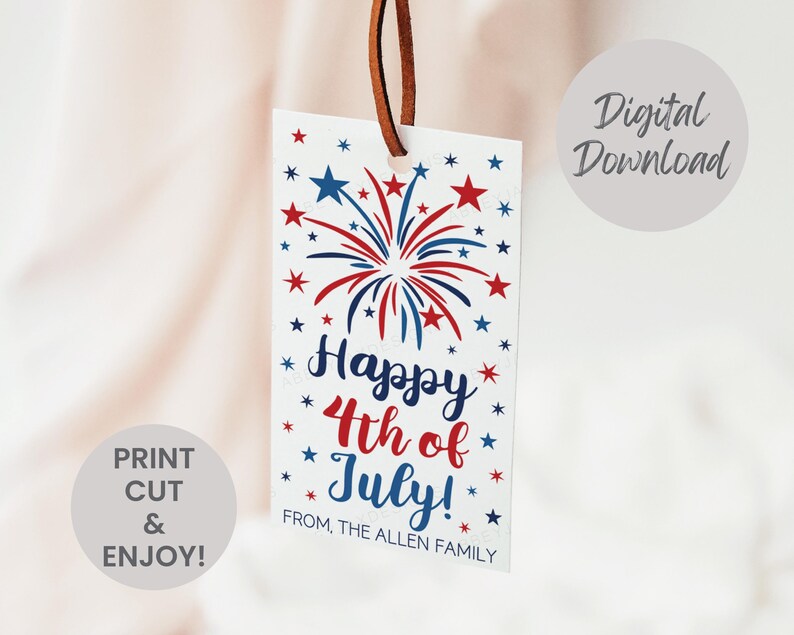 May include: A rectangular white gift tag with a brown leather string featuring red and blue firework illustrations and stars. The text reads Happy 4th of July! FROM, THE ALLEN FAMILY. The image includes Digital Download and PRINT CUT & ENJOY text.
