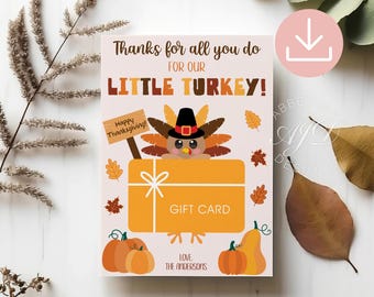 May include: A rectangular card with a light background featuring a cartoon turkey wearing a pilgrim hat, holding a sign that says Happy Thanksgiving! The card includes the text Thanks for all you do for our little turkey! and GIFT CARD.