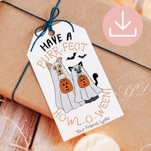 May include: A Halloween gift tag with the text "Have a Purr-fect Howl-o-ween!" featuring cartoon dogs and cats in ghost costumes holding jack-o'-lanterns. The tag is tied with blue string to a brown wrapped gift.