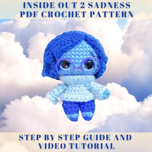 May include: Crochet pattern for a blue and light blue amigurumi doll of Sadness from the movie Inside Out 2. The pattern includes a step-by-step guide and video tutorial.