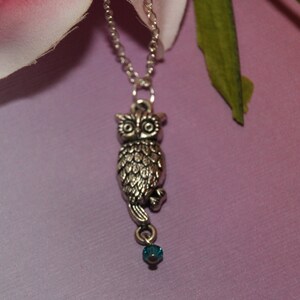 Beautiful antique silver owl pendant on a  sterling silver necklace with a single Aqua Swarovski crystal