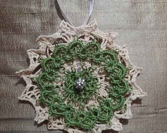 Very pretty hand  tatted Christmas tree ornament.  This one is totally green and off-white.