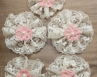 A set of five light pink hand tatted double layered lace flowers. Most of them are over 3" in diameter.