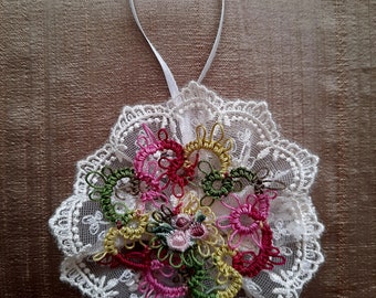 Very pretty Five Dollar hand  tatted Christmas tree ornament.  This one has pretty variegated Christmas colors throughout.