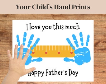 May include: A white card with blue handprints on either side of a yellow ruler with red hearts. The text "I love you this much" is above the ruler and "Happy Father's Day" is below the ruler.