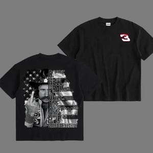 May include: Black t-shirt featuring a graphic of Dale Earnhardt with the American flag and text that reads "Raise Hell, Praise Dale, The American Spirit." The front of the shirt has a red and white number 3.