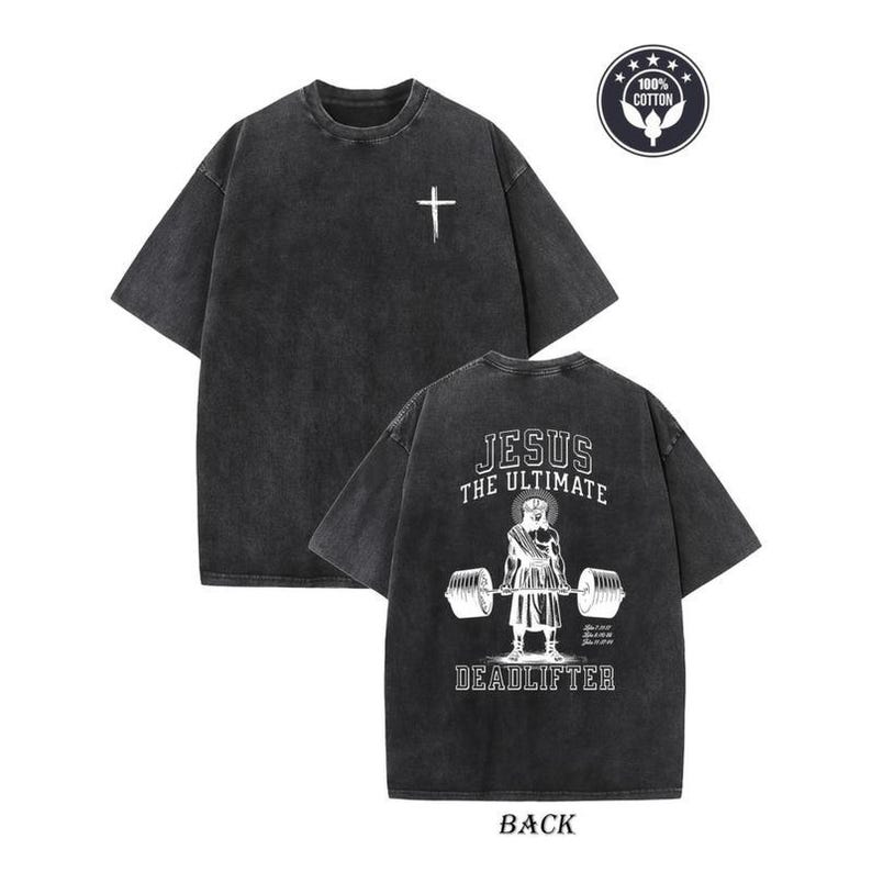 a black t-shirt with a graphic design on the back, depicting a person lifting weights and the text "JESUS THE ULTIMATE DEADLIFTER" printed on it.