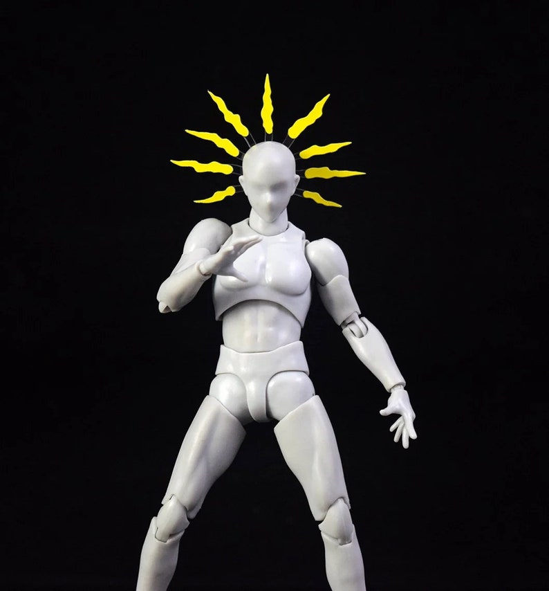 May include: A white articulated figure with a yellow spiky crown on its head. The figure is posed in a dynamic stance with one arm raised and the other extended to the side.