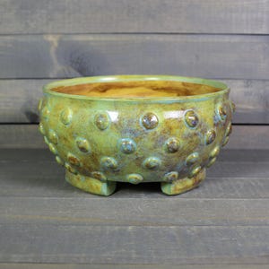 May include: A rustic wooden sign with the text "Welcome to our home" in white lettering. The sign features a distressed finish and a simple, inviting design, perfect for a front porch or entryway.