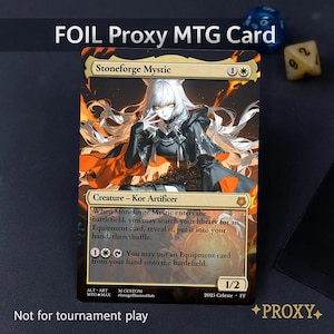 May include: A foil proxy MTG card featuring Stoneforge Mystic. The card has a detailed illustration of a character with white hair and a black outfit, set against a fiery background. Text includes card details and the phrase "Not for tournament play."