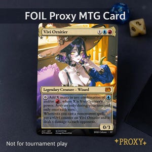 May include: A foil proxy MTG card featuring Vivi Ornitier, a Legendary Creature Wizard. The card art depicts a woman in a witch hat. The card includes text describing abilities and is marked "Not for tournament play."
