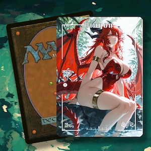 May include: A Magic: The Gathering card featuring a red-haired dragon woman with red wings, horns, and a red outfit. The card is labeled "Dragon" and "Flying". The card is in front of a Magic: The Gathering card back.