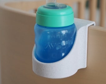 Baby crib bottle holder